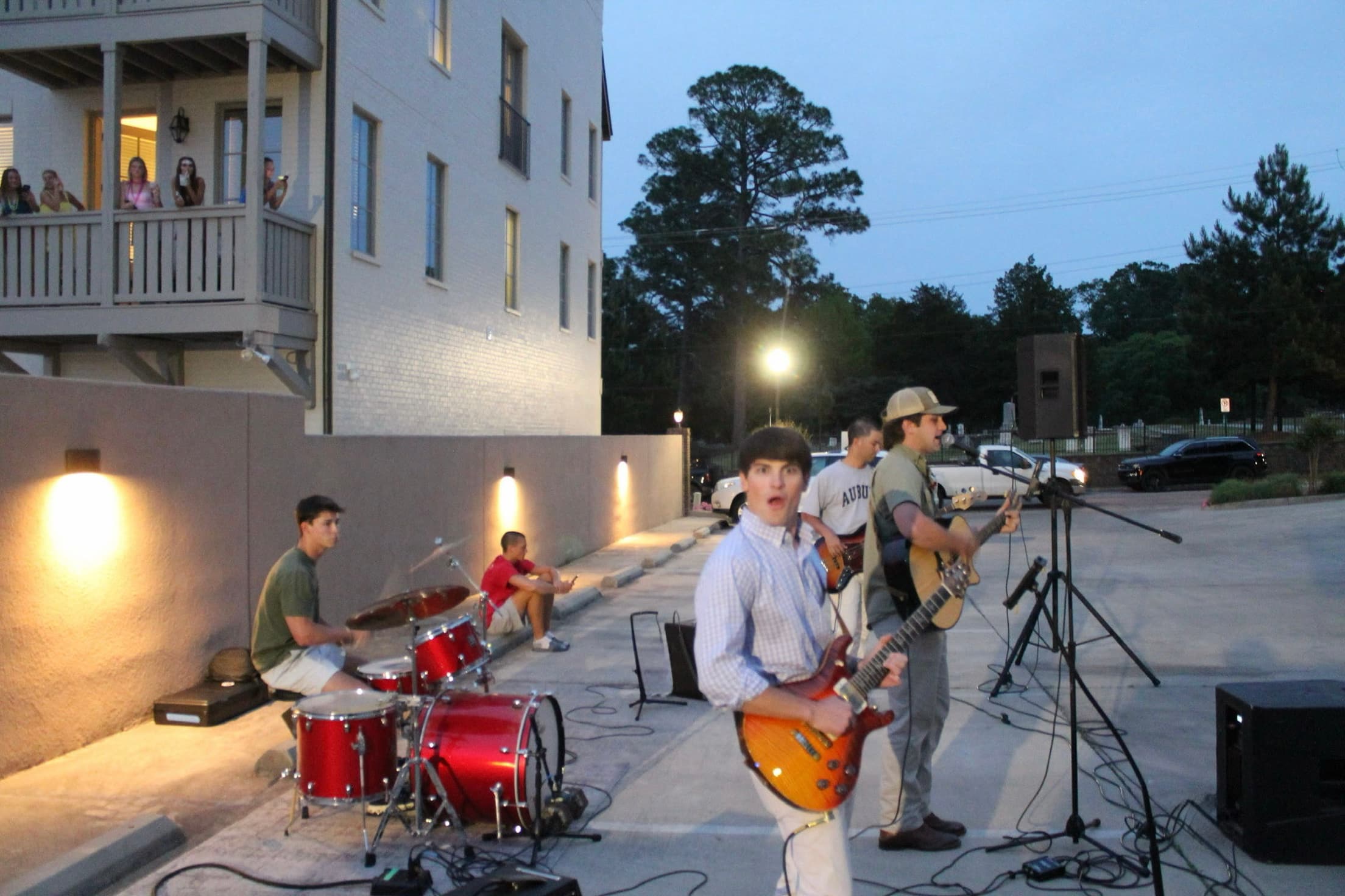 Greyhound performing an outdoor set at dusk